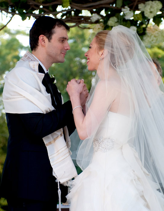 In this handout image provided by Genevieve de Manio, Chelsea Clinton (R) weds Marc Mezvinsky at the Astor Courts Estate on July 31, 2010 in Rhinebeck, New York.