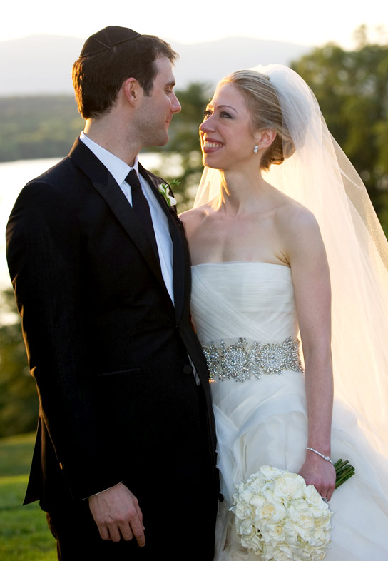In this handout image provided by Barbara Kinney, Marc Mezvinsky (L) and Chelsea Clinton pose during their wedding at the Astor Courts Estate on July 31, 2010 in Rhinebeck, New York.